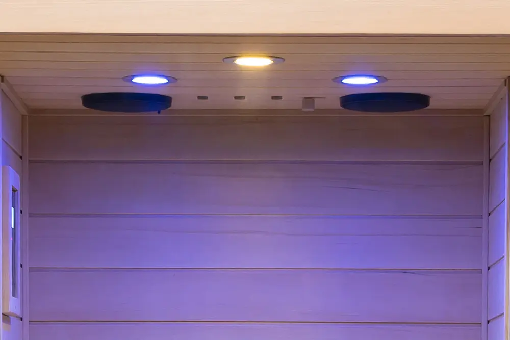 Wizzisaunas 909M mini infrared sauna color LED therapy lights creating soothing and vibrant atmosphere.