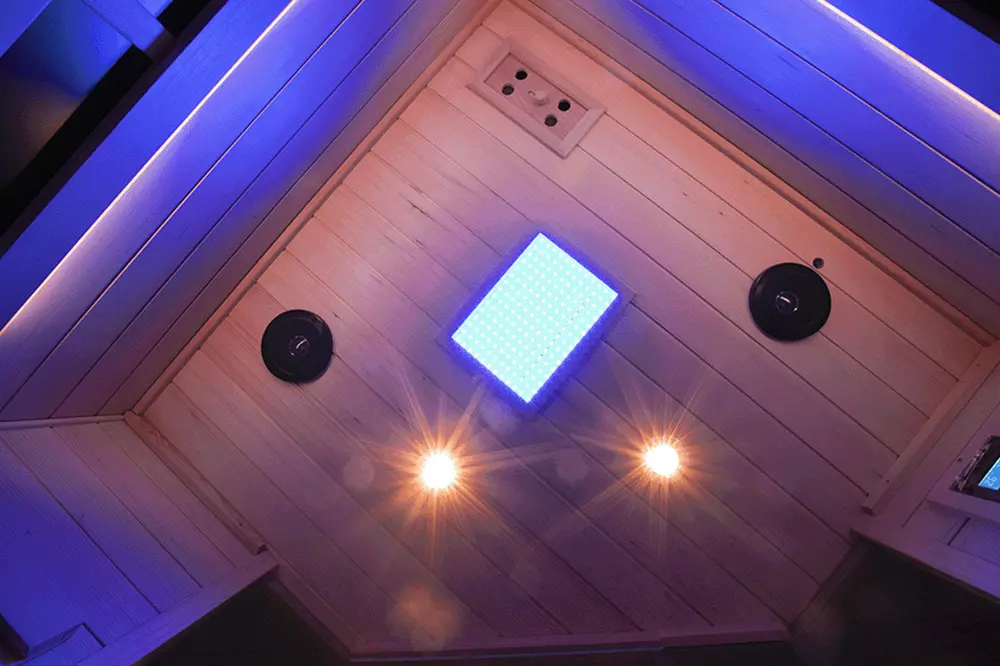 Three-color adjustable reading lights in the Wizzisaunas S07 infrared sauna, offering warm, white, and soft-white options.