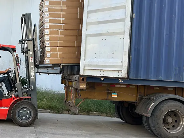 Forklift loading packaged infrared saunas for shipping from sauna-manufacturer Wizzisaunas California warehouse.