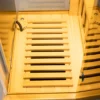 Infrared sauna foot heater panel component showing heating elements and wooden cover for even heat distribution and comfort.