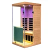 Wizzisaunas 909MHX infrared sauna 45° side view with pink chromotherapy lights and yellow reading light on, highlighting a vibrant and relaxing interior.